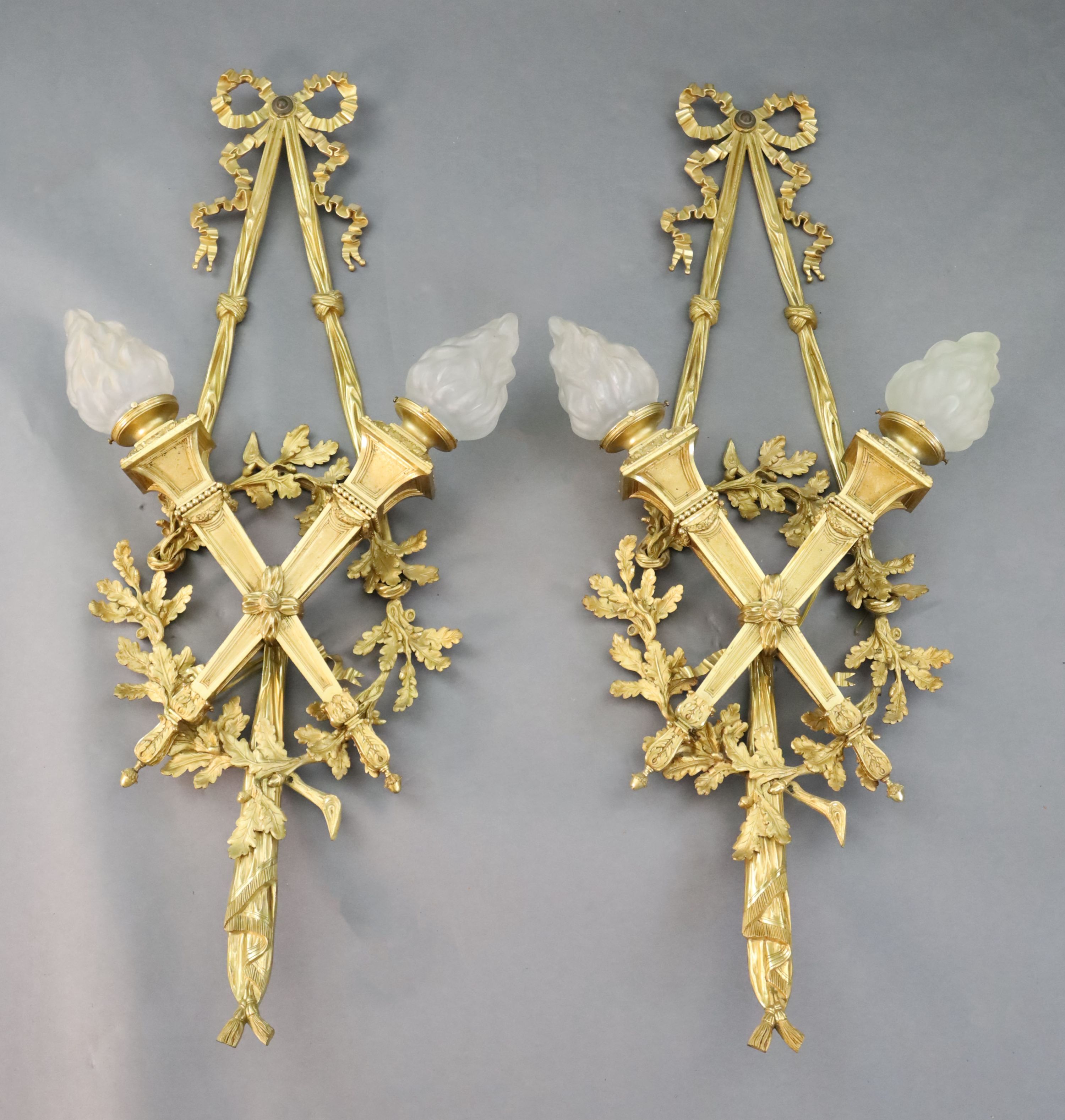 A pair of early 20th century Louis XVI style ormolu wall lights, width 1ft 10in. height 4ft 2in.